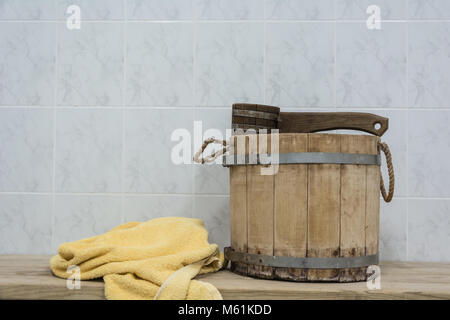 Old Sauna accessories on a wooden bench in a Finnish sauna Stock Photo