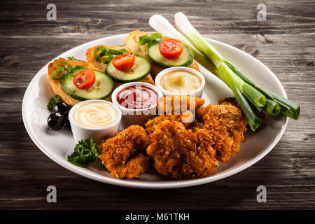 Fried chicken nuggets and vegetables Stock Photo