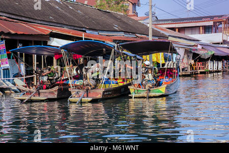 Tourist boats with big engines awaiting passengers at Amphawa Floating Market near Bangkok, Thailand. Stock Photo