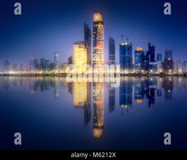 Panorama view of Abu Dhabi Skyline at sunset, UAE Stock Photo