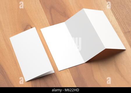 Thrifold - Three fold brochure mock up on wooden background. 3d illustrating Stock Photo