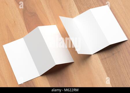 Thrifold - Three fold brochure mock up on wooden background. 3d illustrating Stock Photo