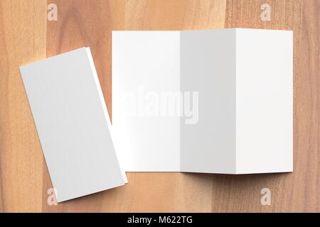 Thrifold - Three fold brochure mock up on wooden background. 3d illustrating Stock Photo