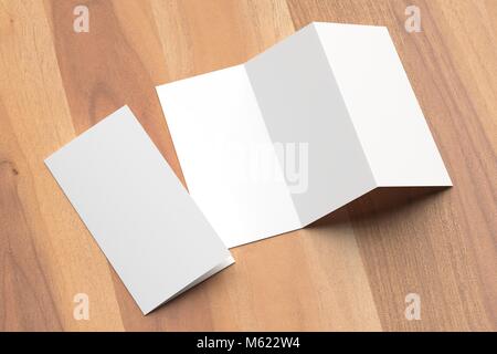 Thrifold - Three fold brochure mock up on wooden background. 3d illustrating Stock Photo