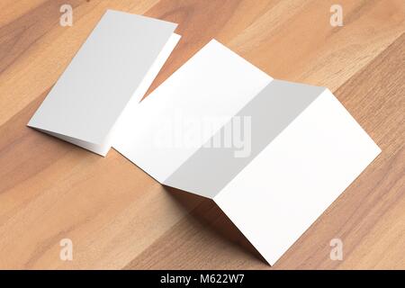 Thrifold - Three fold brochure mock up on wooden background. 3d illustrating Stock Photo