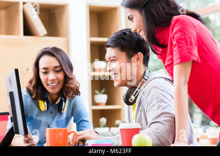 Successful professional team of web designers testing responsive layout Stock Photo