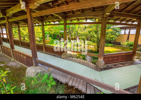 Kyoto, Japan - April 27, 2017: covered corridor that leads to Taho-den hall through the garden of Zen Temple Tenryu-ji in Kyoto, Japan. Tenryuji is most important Temple in Arashiyama. Stock Photo