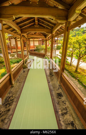 Kyoto, Japan - April 27, 2017:Architecture of Zen Temple Tenryu-ji in Arashiyama in the mountains on western outskirts of Kyoto, Japan. The long covered corridor leads to Hojo hall, to the tearooms. Vertical shot. Unesco site. Stock Photo