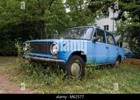 Abandoned Russian car wreck (Lada 1200s) on a car park in Berlin. Stock Photo