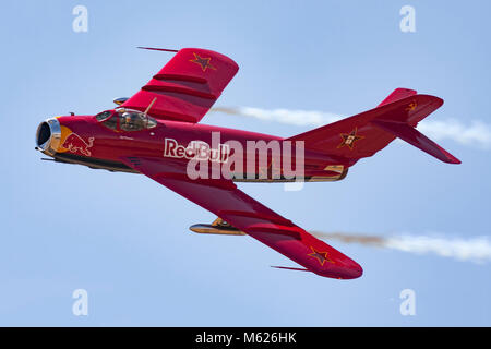 Bill Reesman demonstrates his meticulously maintained Red Bull MiG-17F during an air show at Madera, California, in May of 2009. Reesman's MiG-17F was Stock Photo