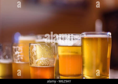 beer flight on table in sunlight Stock Photo