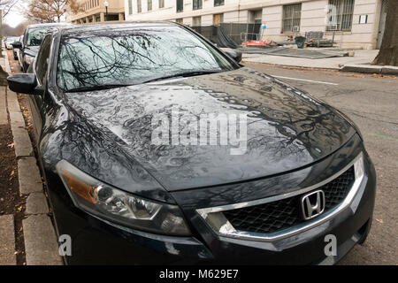 Hail damage on car bonnet - USA Stock Photo