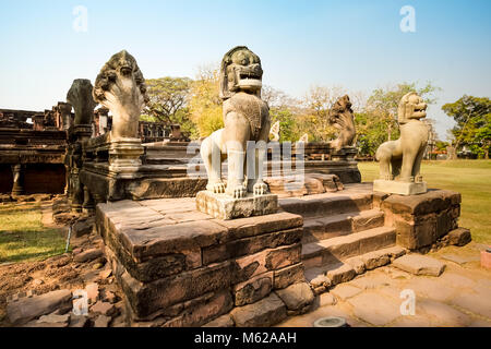 Lion or Singha and Naga sandstone statue in Prasat Hin Phimai of Phimai historical park. Stock Photo