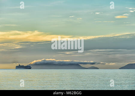 Cruise ship moored off Palm Cove in the Coral Sea at sunrise, Cairns Northern Beaches, Far North Queensland, FNQ, QLD, Australia Stock Photo