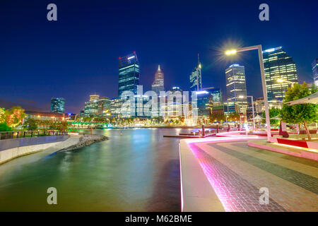 Walkway with night lighting at Elizabeth Quay marina and Esplanade with skyscrapers on Swan River. Perth Downtown skyline the capital city of Western Australia. Stock Photo