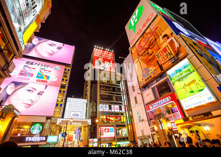 Osaka, Japan - April 29, 2017: bright neon signboard at entrance of Ebisu Bashi-Suji Shopping Street in Namba District, one of the main tourist destinations in Osaka. Namba is famous for nightlife. Stock Photo