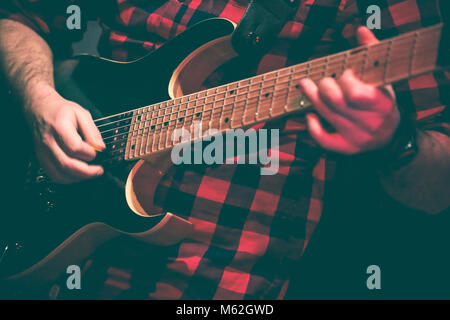 guitarist in action duing a live concert Stock Photo