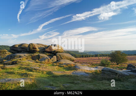 UK,Derbyshire,Peak District,Owler Tor in late summer with Cirrus Cloud formation. Stock Photo