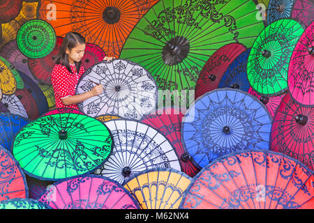 Parasol painter at Bagan, Myanmar (Burma), Asia in February - parasol, parasols, umbrella, umbrellas Stock Photo