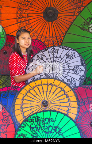 Parasol painter at Bagan, Myanmar (Burma), Asia in February - parasol, parasols, umbrella, umbrellas Stock Photo