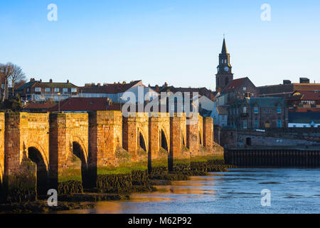 Berwick upon Tweed, view at sunrise of the old 17th Century bridge across the Tweed leading to the town of Berwick upon Tweed, Northumberland, England Stock Photo