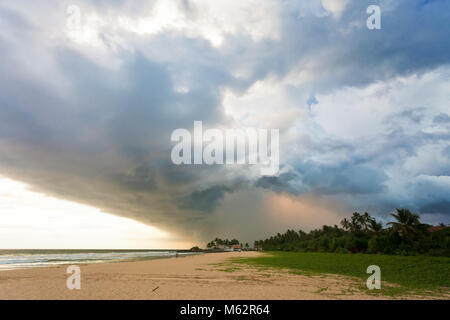 Ahungalla Beach, Sri Lanka, Asia - Impressive clouds and light during sunset at the beach of Ahungalla Stock Photo