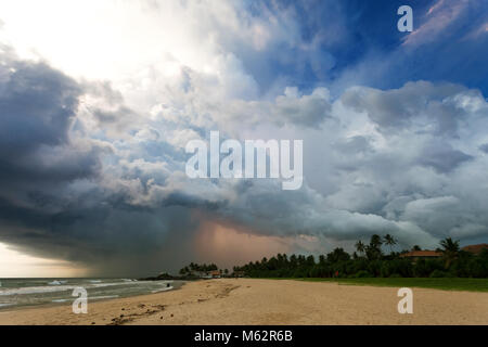 Ahungalla Beach, Sri Lanka, Asia - Impressive thunderstorm during sunset at the beach of Ahungalla Stock Photo