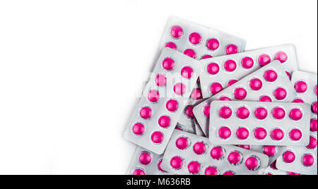 Full frame of pile of ibuprofen in pink tablet pills pack in blue ...