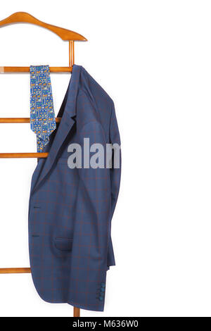 Male classical jacket and a tie are on a jacket hanger stand. Isolated over white Stock Photo