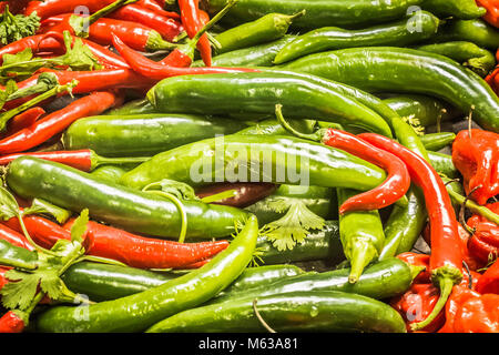 Mixed red and green chilli peppers at Borough market, London UK Stock Photo