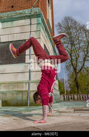 Breakdancer practicing in a public park. Stock Photo