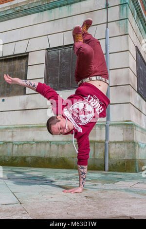 Breakdancer practicing in a public park. Stock Photo