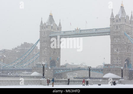 London, 28th Feb 2018. Tower Bridge is barely visible through the snow. Londoners and tourists around City Hall and More London struggle through a heavy snow storm as the 'Beast from the East' takes hold of London. Credit: Imageplotter News and Sports/Alamy Live News Stock Photo