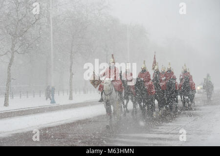 Whitehall, London, UK. 28th February, 2018.   Mounted cavalrymen of the Houshold Cavalrys Lifeguards, carry out ceremonial duties within the midst of a snow storm.   Credit: Byron Kirk/Alamy Live News Stock Photo