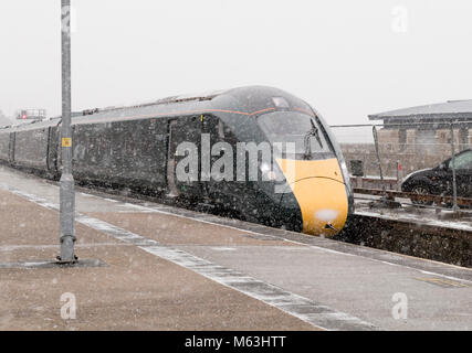 Penzance, Cornwall, UK. 28th Feb, 2018. Heavy snowfall in Penzance, Cornwall. Class 801 Super Express Hitachi train arrives at Penzance during snow fall Stock Photo