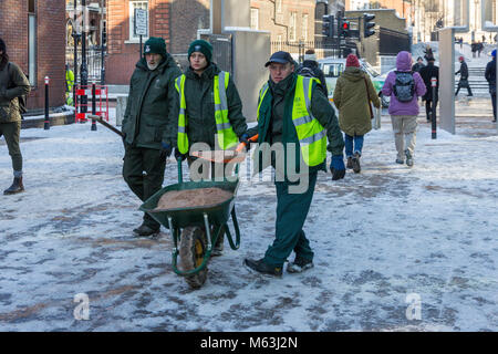 London, UK. 28th Feb, 2018.  Council Workers gritting Peter's Hill, the path between the Millennium Bridge and St Paul's Cathedral, London after snowfall overnight.  Further snow is expected in the next few days.  Credit: Milton Cogheil/Alamy Live News Stock Photo