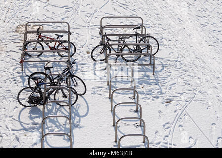 Bicycles in snow, London, England, United Kingdom, UK Stock Photo