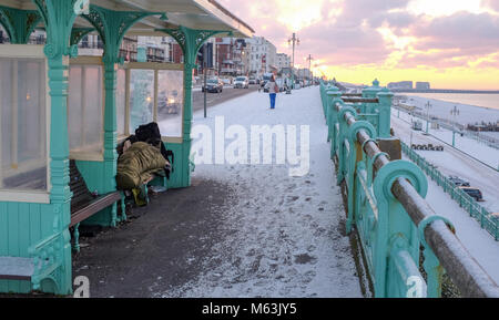 Brighton, UK. 28th Feb, 2018. A homeless person tries to stay warm in a shelter on Brighton seafront in freezing conditions with more cold weather predicted for the rest of the week as 'The Beast from the East' snow storms spread across the country Credit: Simon Dack/Alamy Live News Stock Photo