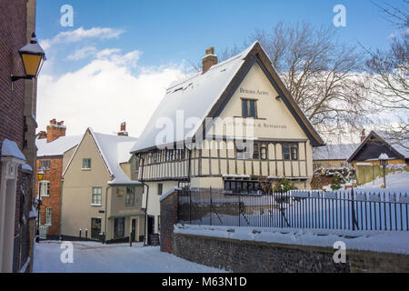 Norwich, Norfolk, UK. 28th February, 2018. The Britons Arms café, on historic Elm Hill in Norwich, stays open despite snowy weather, with a sign outside, 'We Beat the Beast from the East' 28 February 2018 Credit: SPK/Alamy Live News Stock Photo