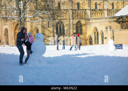 Norwich, Norfolk, UK. 28th February 2018. Snow and Snowmen in front of Norwich Cathedral close, with a scarf of snow after snow storm nicknamed the 'the Beast from the East' 28 February 2018 Credit: SPK/Alamy Live News Stock Photo
