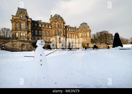 Bowes Museum, Barnard Castle, County Durham, UK.  Wednesday 28th February 2018. UK Weather.  After a day of heavy snow the clouds break to allow some late afternoon light to illuminate the Bowes Museum in Barnard Castle. David Forster/Alamy Live News Stock Photo