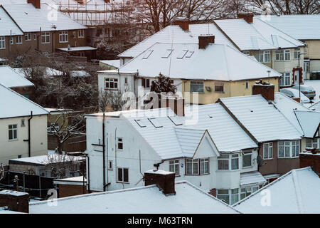 London, UK. 28th Feb, 2018. UK Weather: Snow covered houses at sunrise in North London Credit: Raymond Tang/Alamy Live News Stock Photo