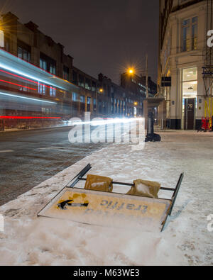 London, England, UK. 28th Feb, 2018. UK Weather: Traffic passes a roadsign knocked down by the 'Beast From The East' snowstorm at Farringdon in London. Credit: Joe Dunckley/Alamy Live News Stock Photo