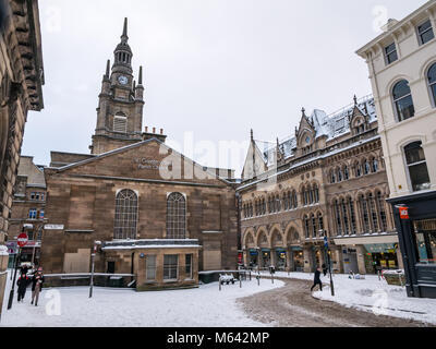 Glasgow, Scotland, United Kingdom, 28th February 2018.  UK Weather: Heavy snowfall from so-called arctic ‘Beast from the East’ at morning rush hour in the city centre. The streets quieter than usual, with people walking to work and no cars on the street. Only pedestrians in Nelson Mandela Place Stock Photo