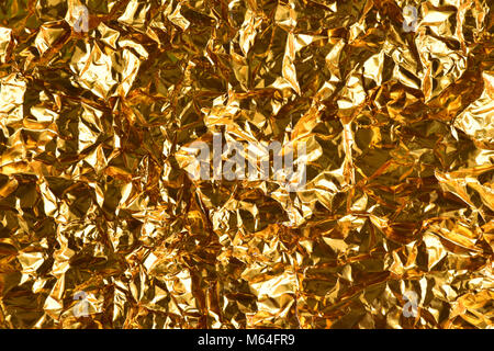 Screwed up  crumpled gold and silver foil Stock Photo