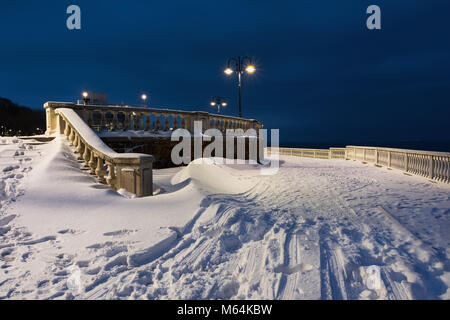 Snow landscape in Burgas Sea Garden, near the Culture center Sea Casino at blue hour. Winter sunset over the sea in Burgas bay, Black Sea, Bulgaria. Stock Photo