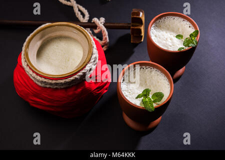 Lassie or lassi in terracotta glass - Lassi is an Authentic Indian cold drink made up of curd and milk and sugar, selective focus Stock Photo