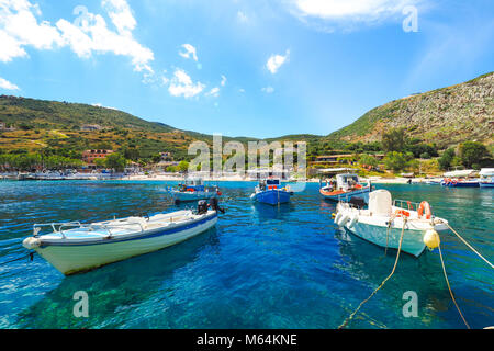 Agios Nikolaos Port Zakynthos island in the summer, with clear blue water and boats Stock Photo