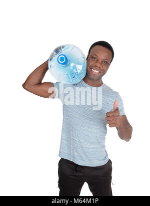 A young smiling African American man carrying a blue big water bottle on his shoulder with thump up, isolated for white background Stock Photo