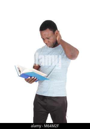 An attractive young African American man holding his book and is wondering what he is reading, isolated for white background Stock Photo